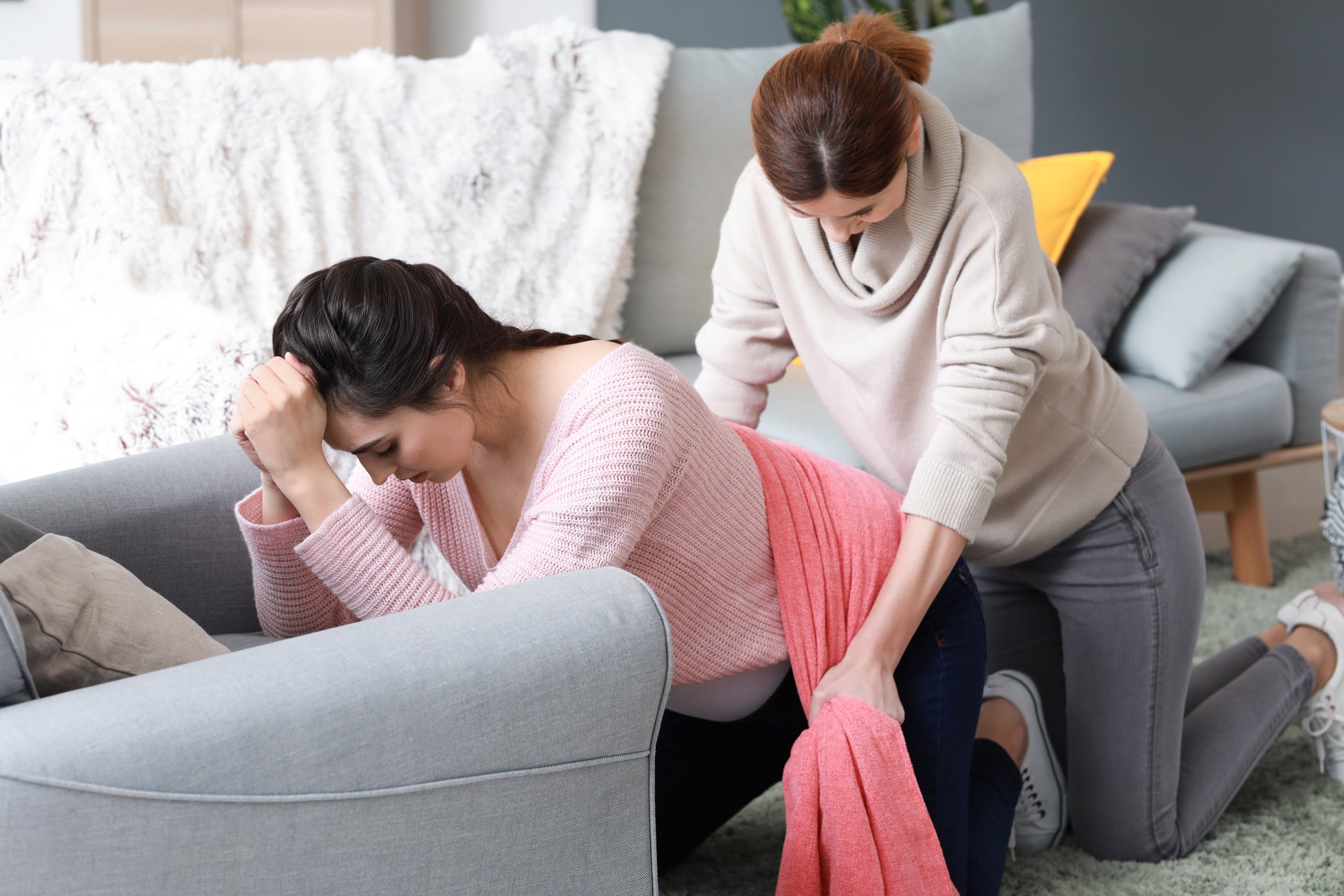 Pregnant Woman Undergoing a Doula Massage a at Home